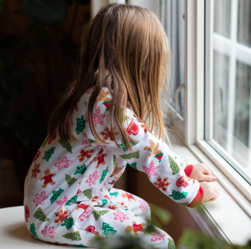 Child next to window